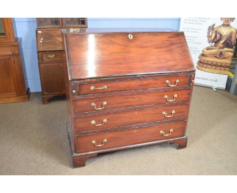 Georgian mahogany bureau with four drawer base raised on bracket feet, 107cm wide