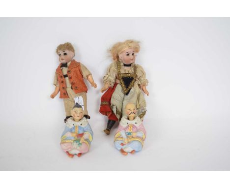 Pair of Oriental ceramic nodding dolls, together with two further small dolls with bisque painted heads (4)