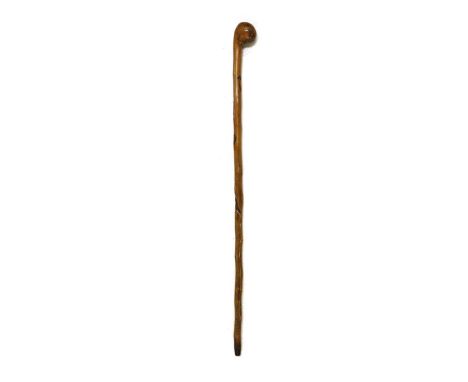 A Japanese hardwood walking stick, carved with a partially concealed snake hunting a mouse. 89cm longCondition report: A few 