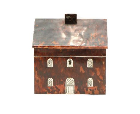 A tortoiseshell and bone tea caddy, 20th Century, in the form of a house with a pitched roof, chimney stack, carved bone fron