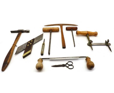 A collection of tools, to include a draw knife, 28cm wide, an auger, stamped 'Stokes &amp; Co', 26cm long, a similar example,