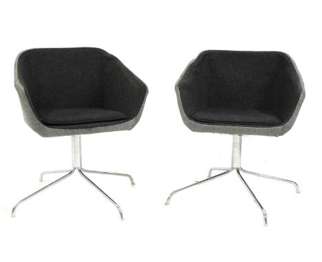 A pair of modern 'Quiet' swivel chairs, designed by Michael Sodeau for Modus, each upholstered in herringbone wool, raised on