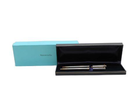 A Tiffany &amp; Co ballpoint pen and retractable pencil, with white metal bodies and brass fitments including the 'T' clip, c
