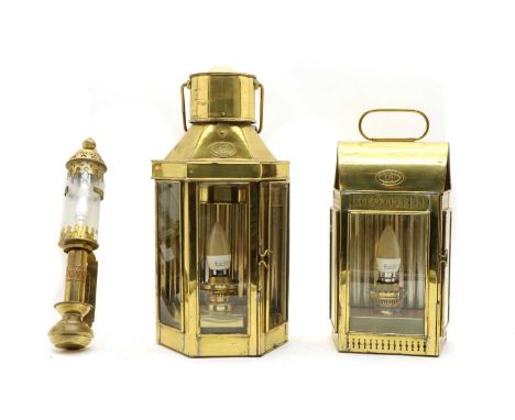 A Christopher Wray brass lantern, with a shaped front, and carry handle, 21.5cm wide, 50cm high,  together with another Chris
