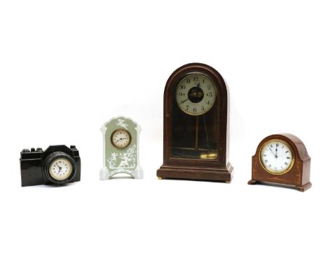 An oak cased Bulle Patent mantel clock, with an arched glazed door, inscribed ‘G. C. Kendall &amp; Son Stratford-on-Avon’, 35