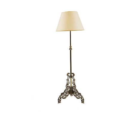 A brass standard lamp, late 19th to early 20th century, with scrolled frame, 156cm to fittingCondition report: Wear and knock