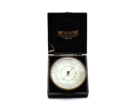 A brass-cased marine holosteric or aneroid barometer, late 19th/ early 20th century, American, by T.S. &amp; J.D. Negus Navig