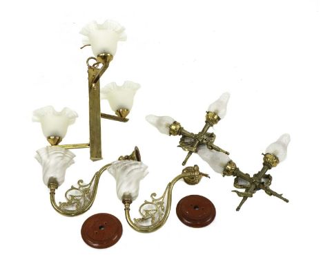 A collection of brass lighting, to include an Edwardian three branch ceiling light, in the Arts &amp; Crafts taste, with a tr