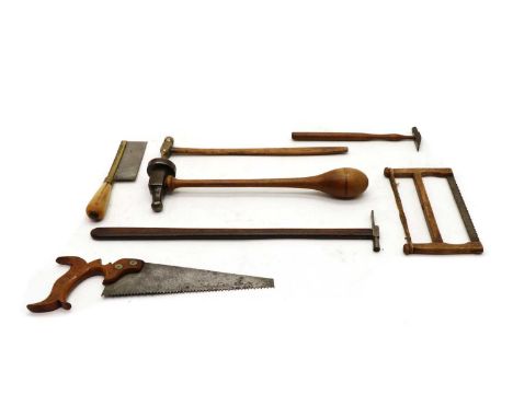 A collection of miniature tools, to include a panel beater's hammer, 24cm long, three further hammers, a miniature bow saw, 1