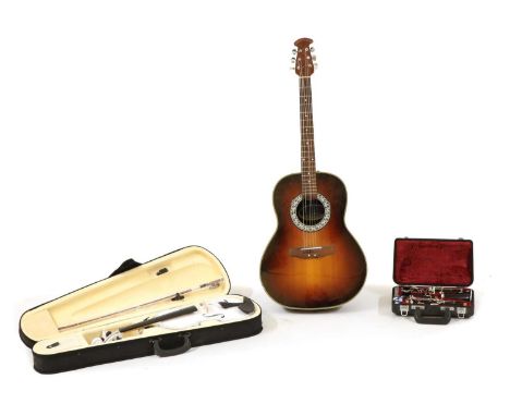 An Ovation 'Celebrity' six string guitar, a white painted violin and bow in case and a Yamaha clarinet in fitted case,Conditi