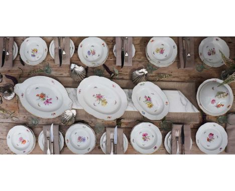A KPM Berlin porcelain part dinner service, c.1890, comprising: a large twin-handled oval platter, 2 graduated smaller platte