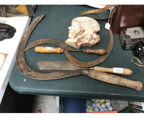 A SET OF THREE HAND SCYTHES WITH WOODEN HANDLES AND FURTHER TOOL 