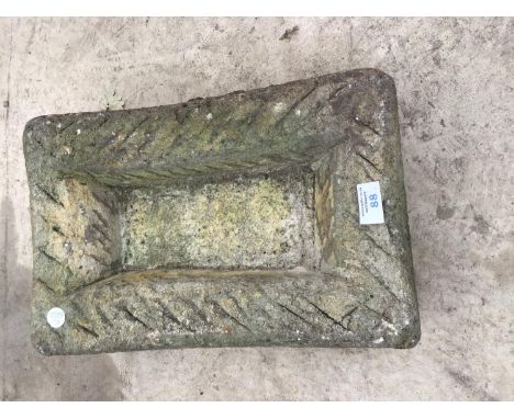 A SMALL CONCRETE TROUGH 38CM X 25CM 