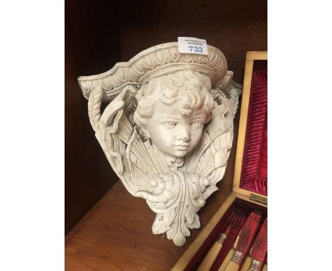 A STONEWARE 'CHERUB' GARDEN SHELF 