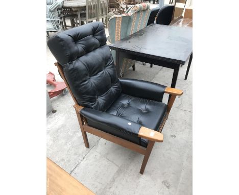 A RETRO BLACK BUTTON BACK LEATHER AND BEECH ARMCHAIR 