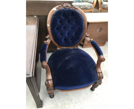 A CARVED MAHOGANY BEDROOM CHAIR WITH BLUE BUTTON BACK UPHOLSTERED DESIGN 