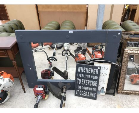 FOUR ITEMS - A GREY FRAMED MIRROR, TWO NOVELTY SIGNS AND A FIREGUARD 