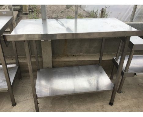 A STAINLESS STEEL TABLE WITH LOWER SHELF 110CM X 65CM X 97CM HIGH 