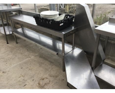 A STAINLESS STEEL TWO SHELF UNIT WITH UNDER SHELF LIGHTING 