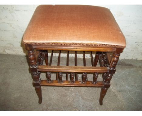 AN ANTIQUE STOOL WITH STRETCHER SHELF AND GALLERY UPRIGHT DESIGNE