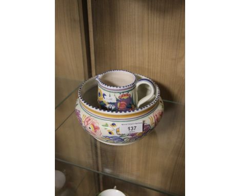 A POOLE POTTERY VAVSE AND A JUG