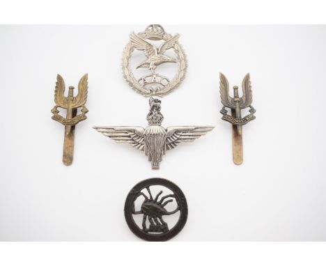 A Second World War Army Air Corps cap badge together with post-War SAS, LRDG and Parachute Regiment cap badges