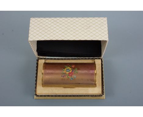 A cased vintage Kigu musical powder compact