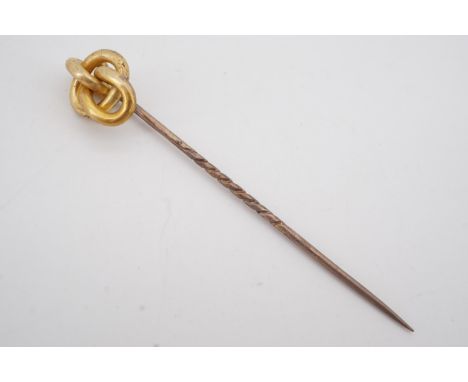 A Victorian gentleman's yellow metal stick pin, the terminal in the form of a knot, 1.6 g