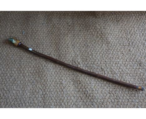 A contemporary rustic walking stick, the pommel carved and painted as a bird's head, 95 cm