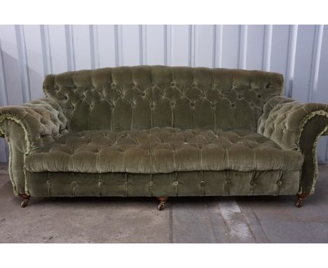 A Victorian deep-button-upholstered three-seater sofa