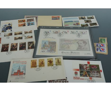 A quantity of stamps and first day covers including a Charles Dickens limited edition £10 banknote FDC