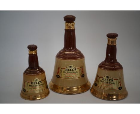 Three Wade Bell's whisky decanters