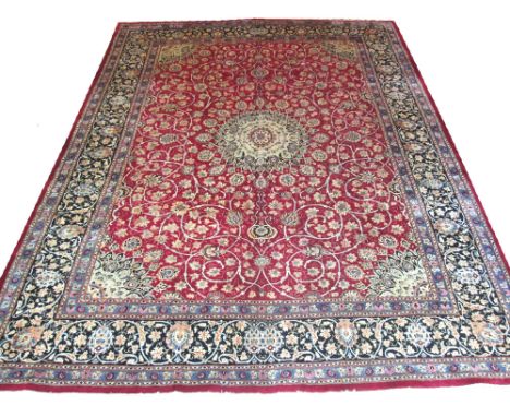 FINE VINTAGE KASHAN CARPET, 385cm x 300cm, central medallion on a terracotta field of grape leaf, vine and palmettes inside q