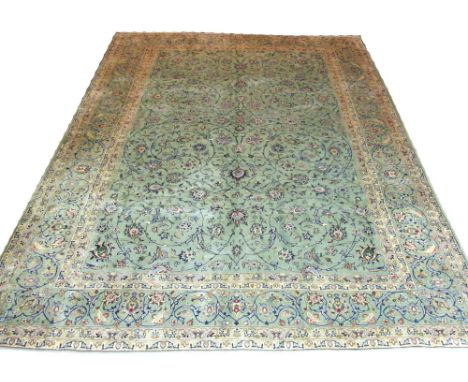 FINE SIGNED KASHAN CARPET, 400cm x 300cm, all over design of palmettes and scrolling vines on a jade field within correspondi