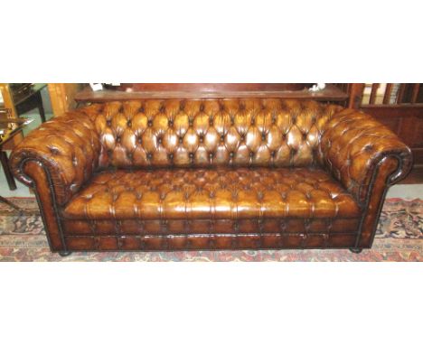 CHESTERFIELD SOFA, faded tan brown leather upholstered with rounded deep button back arms and seat, 205cm W.