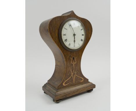 EDWARDIAN MANTEL CLOCK, the waisted case inlaid with brass Art Nouveau detail, 25.5cm H. 