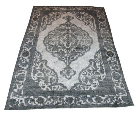 VINTAGE KERMAN CARPET, 285cm x 205cm, organic pole medallion inside corresponding spandrels and borders in an en gris finish.