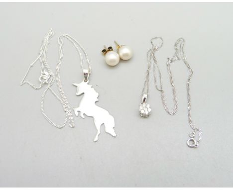 A 9ct white gold and diamond pendant on 9ct gold chain, 1.7g, cultured pearl earrings and a silver unicorn pendant and chain 