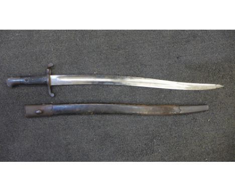 A Victorian military bayonet with scabbard, marks including WD with broad arrow 