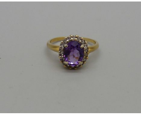 A silver gilt, amethyst ring with zircon halo, O 