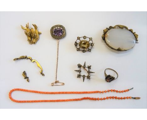 A gold, amethyst and seed pearl set brooch, detailed 9 CT, a citrine and seed pearl set oval brooch, two further brooches, a 