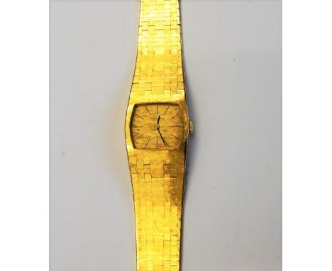 A lady's International Watch Company gold bracelet wristwatch, the signed textured gilt dial with black baton numerals and wi
