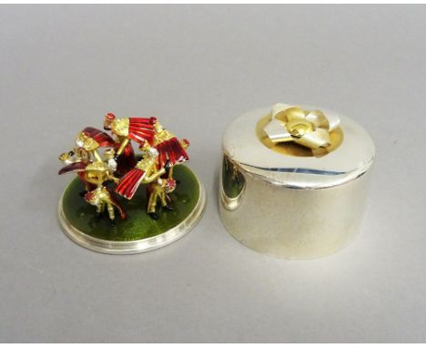 A Stuart Devlin Christmas box, containing a silver gilt and enamelled model representing the tenth day of Christmas, being Te