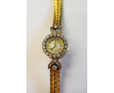 A Jaeger-le Coultre gold and diamond set rear winding lady's bracelet wristwatch, the signed silvered dial with dot and arrow