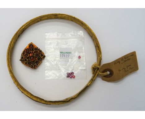 A Burmese gold cased and cabochon ruby set umbrella ring, of circular form, mounted with cabochon rubies, some rubies lacking