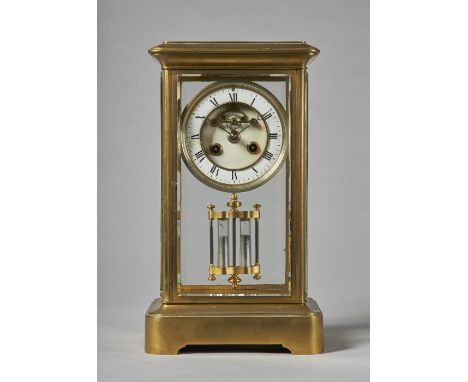 A French giltbrass four-glass mantel clockCirca 1870With a stepped pediment above bevelled glass panels, the white enamel cha