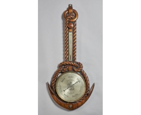 A Victorian carved walnut nautical themed wheel barometerSigned Gray & Keen, Liverpool, circa 1860In the form of an anchor an