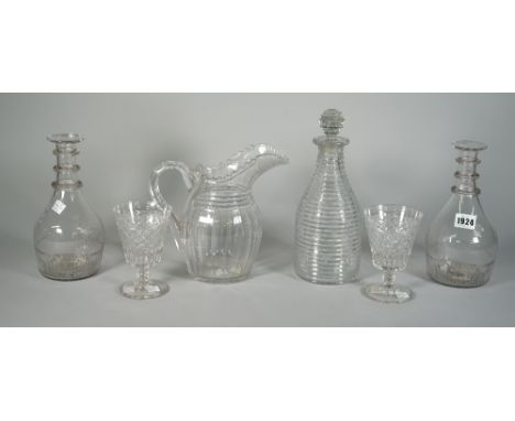 A group of glassware, 19th century, comprising; a pair of moulded triple-ring neck decanters, 22.5cm. high; a step cut decant