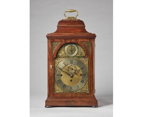 A mahogany cased three train quarter chiming bracket clockThe bell-top case with a brass carrying handle, above a moulded ped