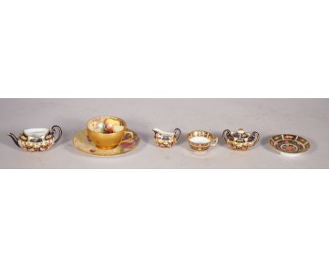 A Royal Worcester fruit painted cabinet cup and saucer, circa 1918, the saucer signed F.Harper, the cup W.Hart, and three Roy